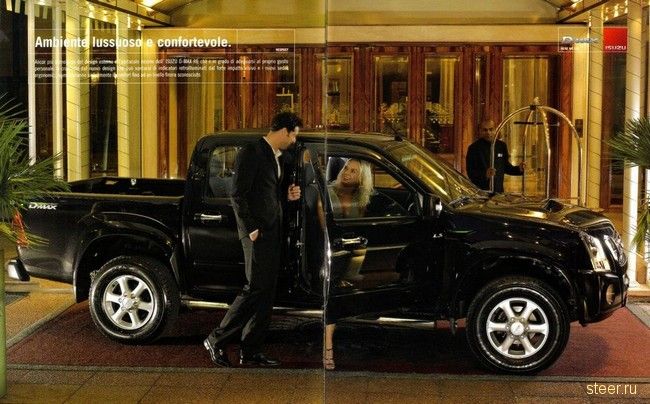 длинноногая блондинка рекламирует Isuzu D-Max Crystal
